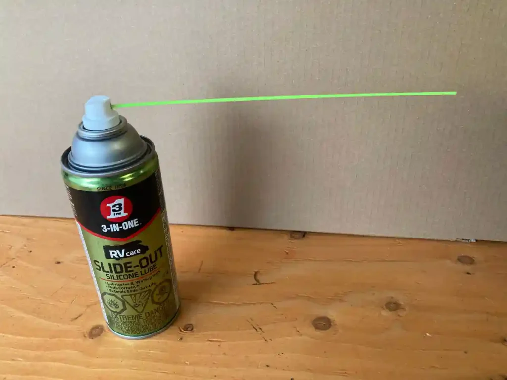 applying silicone lubricant to RV black tank gate valve to prevent sticking